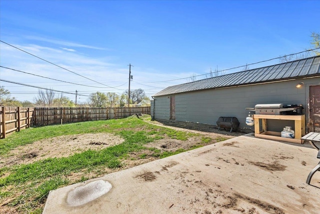 view of yard featuring a fenced backyard and a patio area