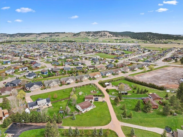 birds eye view of property with a residential view and a mountain view