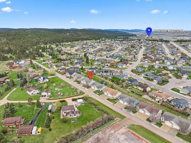 birds eye view of property with a residential view