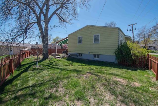 2608 Maple Ave, Rapid City, SD 57701 - view of home's exterior featuring a yard and a fenced backyard