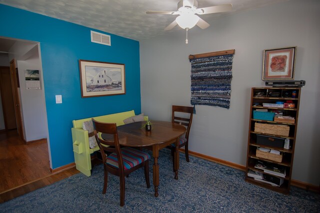 2608 Maple Ave, Rapid City, SD 57701 - dining area featuring visible vents, wood finished floors, baseboards, and ceiling fan