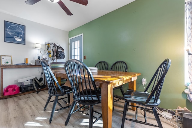 dining space featuring ceiling fan and wood finished floors
