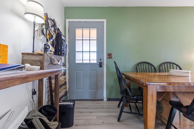 dining area featuring light wood-style flooring