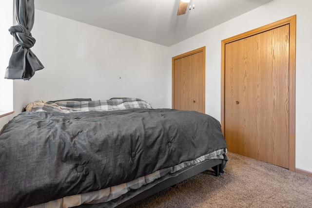 carpeted bedroom with ceiling fan