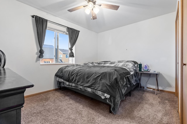 bedroom with baseboards, a ceiling fan, and carpet floors