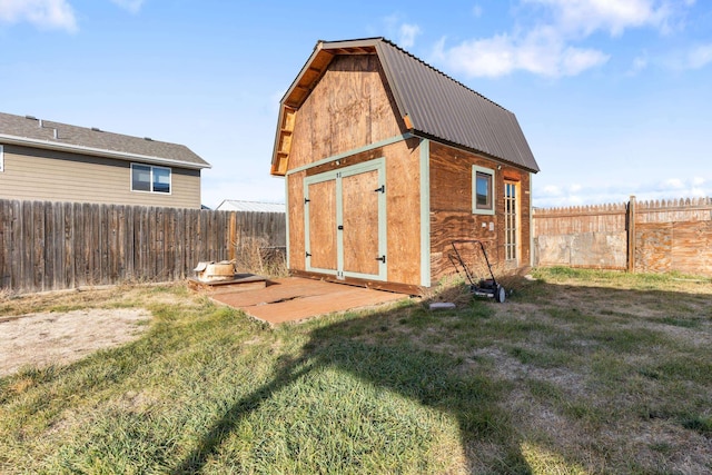 view of shed featuring a fenced backyard