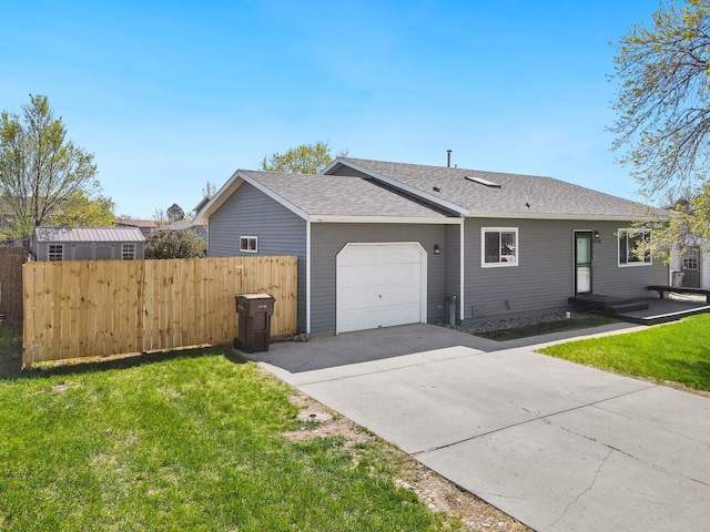 view of front of house featuring an attached garage, driveway, and a shingled roof