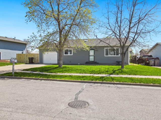 single story home featuring driveway and an attached garage