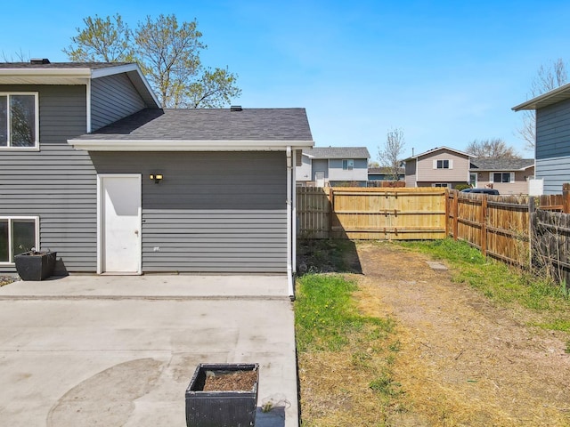 fenced backyard with a patio area