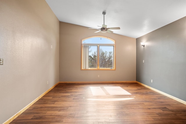 1245 Pine Cone Ln, Rapid City, SD 57701 - unfurnished room with ceiling fan, lofted ceiling, wood finished floors, and baseboards