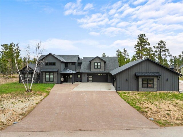 view of front of property with concrete driveway and an attached garage