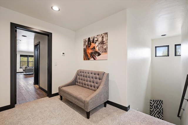sitting room featuring carpet flooring, baseboards, and recessed lighting