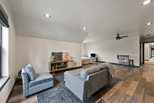 living area with wood finished floors, a ceiling fan, and recessed lighting