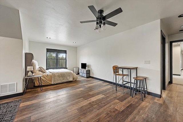 bedroom featuring hardwood / wood-style floors and baseboards
