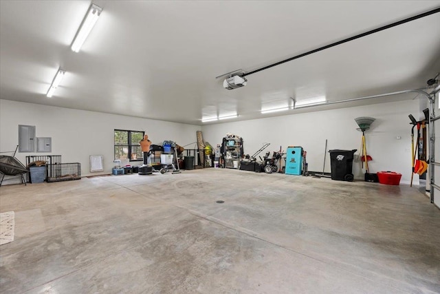 garage featuring a garage door opener and electric panel