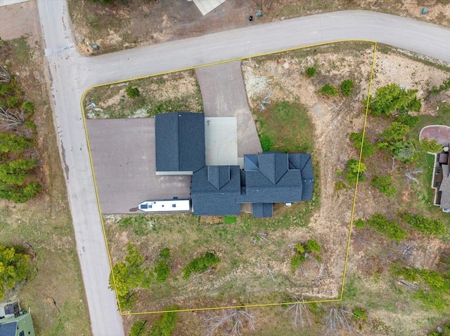 aerial view of property and surrounding area featuring property parcel outlined