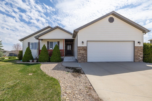 ranch-style house featuring driveway, covered porch, stone siding, and a garage