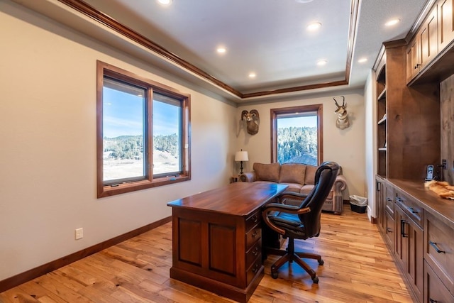 home office with a raised ceiling, light wood-type flooring, recessed lighting, and baseboards