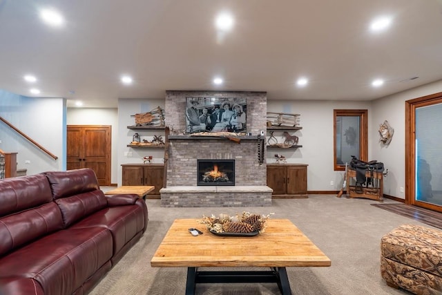 living room with carpet flooring, recessed lighting, a fireplace, stairway, and baseboards
