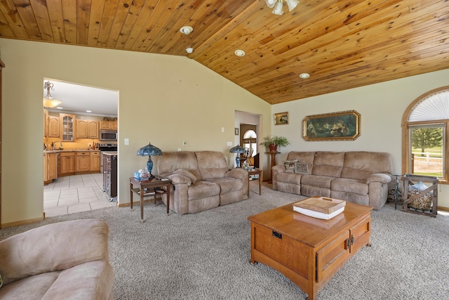 6494 Blake Rd, Rapid City, SD 57702 - living area featuring light colored carpet, lofted ceiling, wood ceiling, and baseboards