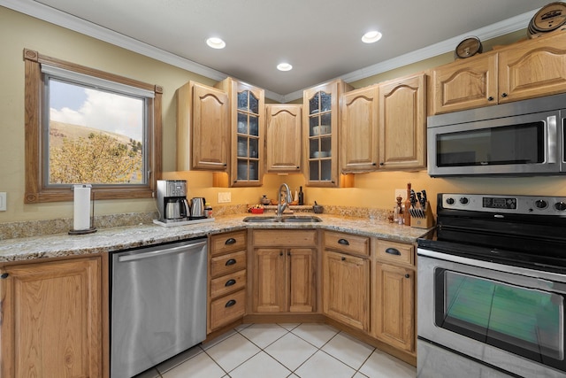 6494 Blake Rd, Rapid City, SD 57702 - kitchen with stainless steel appliances, a sink, ornamental molding, light tile patterned floors, and light stone counters