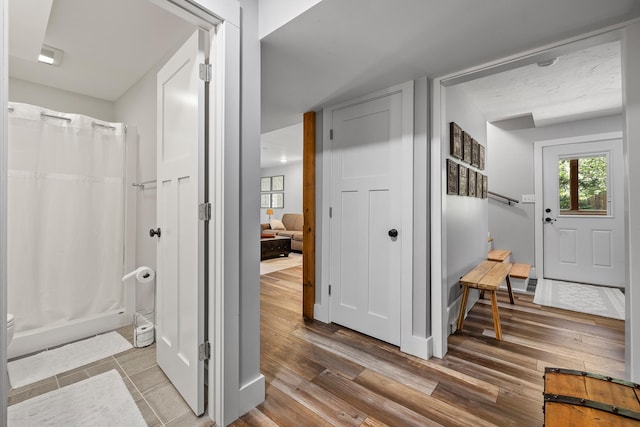 foyer featuring wood finished floors