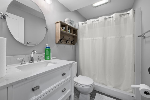 bathroom featuring toilet, vanity, a stall shower, vaulted ceiling, and tile patterned flooring