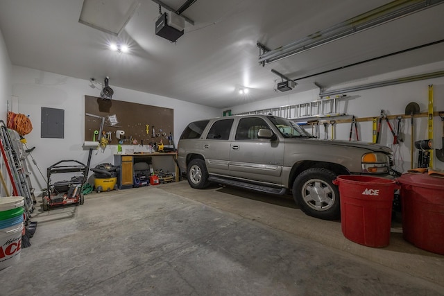 garage featuring a garage door opener and electric panel