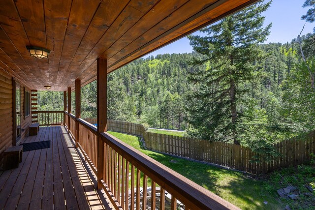 deck featuring a forest view