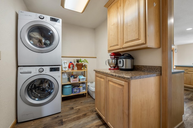 4202 Mary Dr, Rapid City, SD 57702 - clothes washing area featuring stacked washer / dryer, dark wood-type flooring, cabinet space, and recessed lighting