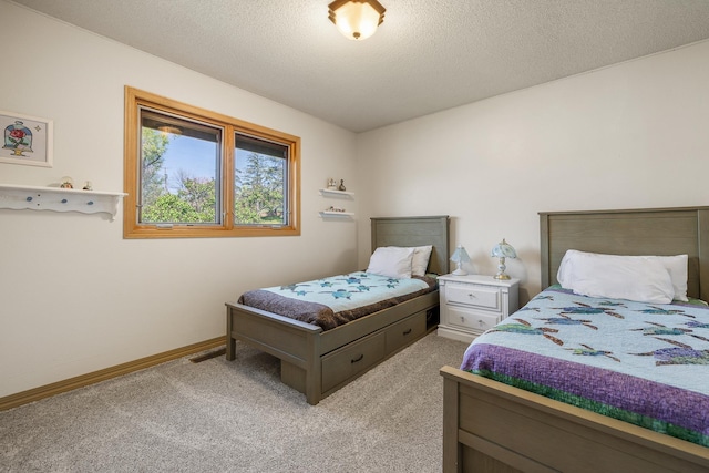 4202 Mary Dr, Rapid City, SD 57702 - carpeted bedroom featuring a textured ceiling and baseboards