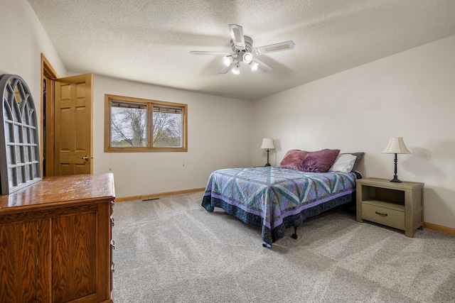 4202 Mary Dr, Rapid City, SD 57702 - bedroom featuring carpet floors, baseboards, a textured ceiling, and ceiling fan