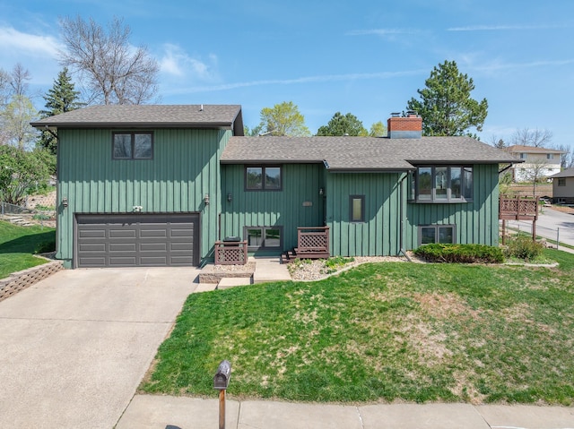 4202 Mary Dr, Rapid City, SD 57702 - view of front of house with a garage, a chimney, roof with shingles, and a front yard