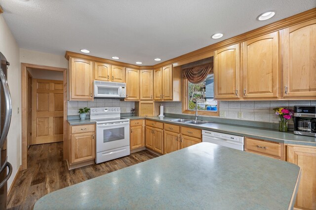 4202 Mary Dr, Rapid City, SD 57702 - kitchen with white appliances, a sink, dark wood-style floors, backsplash, and recessed lighting