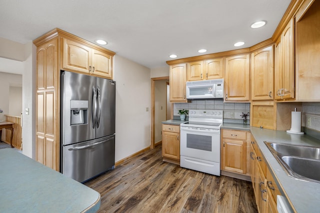 4202 Mary Dr, Rapid City, SD 57702 - kitchen featuring white appliances, a sink, decorative backsplash, dark wood finished floors, and recessed lighting