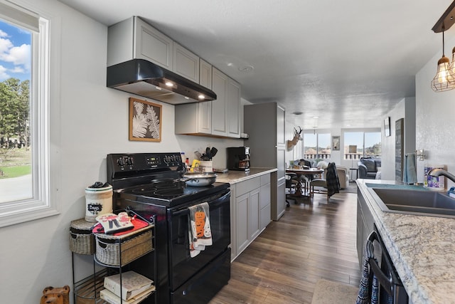 101 E Summit St, Lead, SD 57754 - kitchen with black appliances, under cabinet range hood, a sink, and plenty of natural light