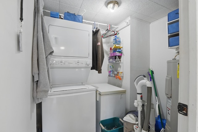 101 E Summit St, Lead, SD 57754 - laundry area featuring stacked washer and clothes dryer and electric water heater