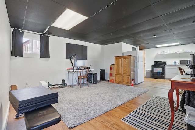101 E Summit St, Lead, SD 57754 - living room featuring a paneled ceiling and wood finished floors