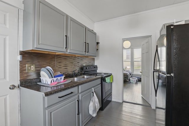 101 E Summit St, Lead, SD 57754 - kitchen with black appliances, gray cabinetry, a sink, dark countertops, and dark wood-style flooring