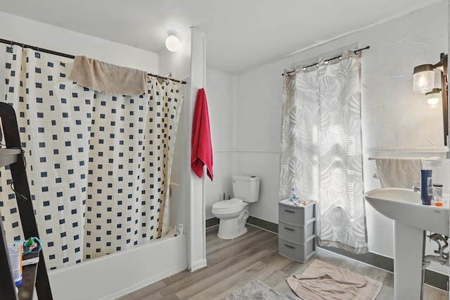 101 E Summit St, Lead, SD 57754 - full bath with wood finished floors, toilet, and shower / bathtub combination with curtain