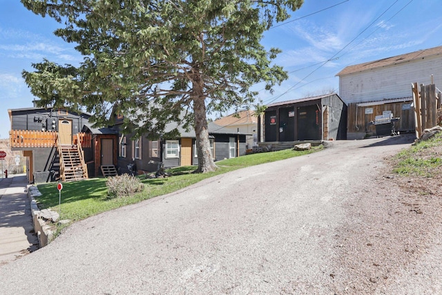 101 E Summit St, Lead, SD 57754 - view of front facade featuring a sunroom and driveway