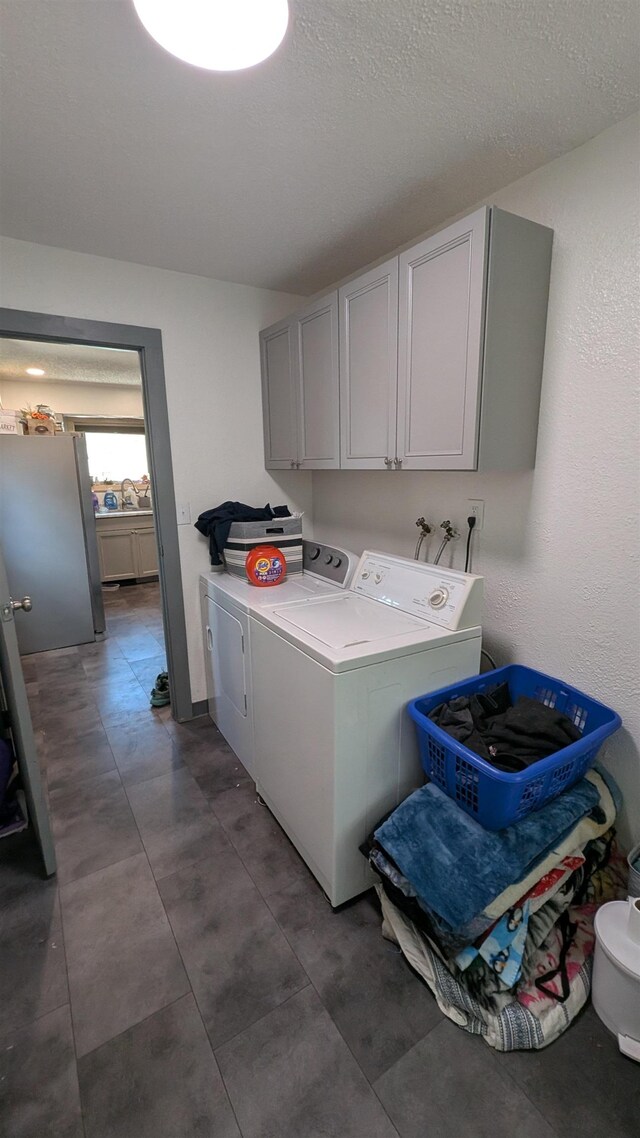 125 S Galena St, Lead, SD 57754 - clothes washing area with washing machine and dryer and cabinet space