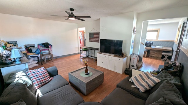 125 S Galena St, Lead, SD 57754 - living room with a ceiling fan, light wood-style flooring, and a textured ceiling