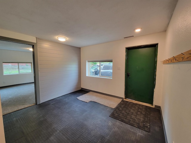 125 S Galena St, Lead, SD 57754 - entrance foyer with dark colored carpet and baseboards