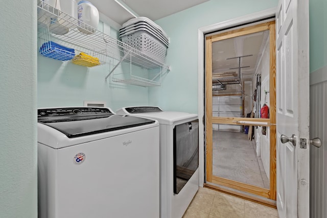 4103 Waterville Ct, Rapid City, SD 57702 - laundry room with washing machine and clothes dryer and light tile patterned floors