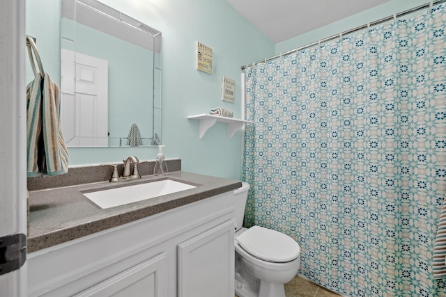 4103 Waterville Ct, Rapid City, SD 57702 - full bathroom featuring toilet, vanity, a shower with shower curtain, and tile patterned floors
