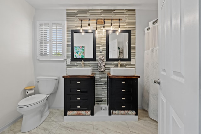 4103 Waterville Ct, Rapid City, SD 57702 - bathroom with marble finish floors, baseboards, toilet, and double vanity