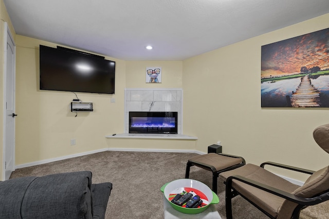 4103 Waterville Ct, Rapid City, SD 57702 - carpeted living room with a tiled fireplace, recessed lighting, and baseboards