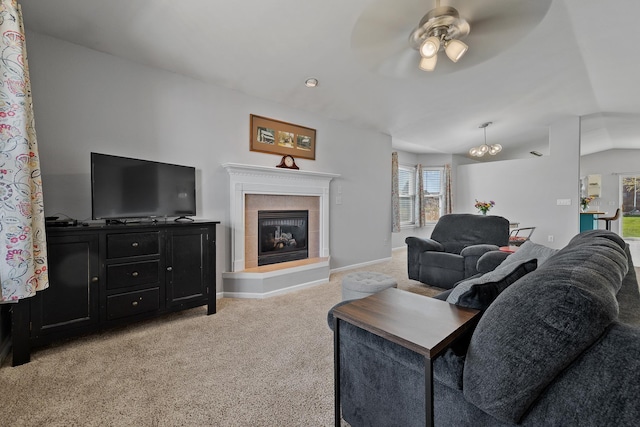 4103 Waterville Ct, Rapid City, SD 57702 - living room featuring light colored carpet, ceiling fan, a chandelier, a tiled fireplace, and baseboards