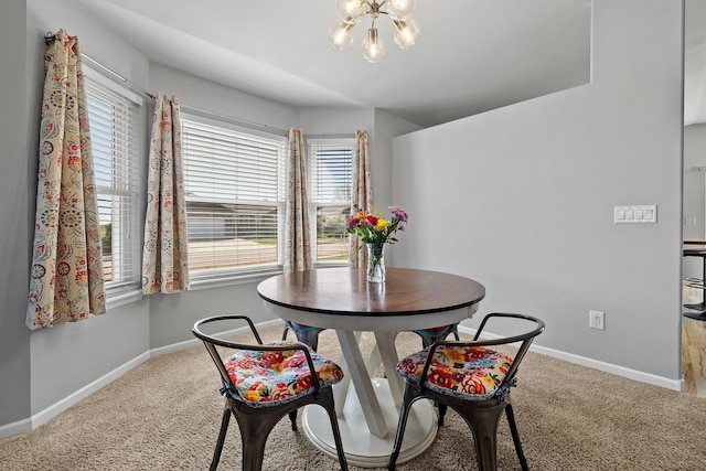 4103 Waterville Ct, Rapid City, SD 57702 - dining space featuring a chandelier, carpet flooring, and baseboards